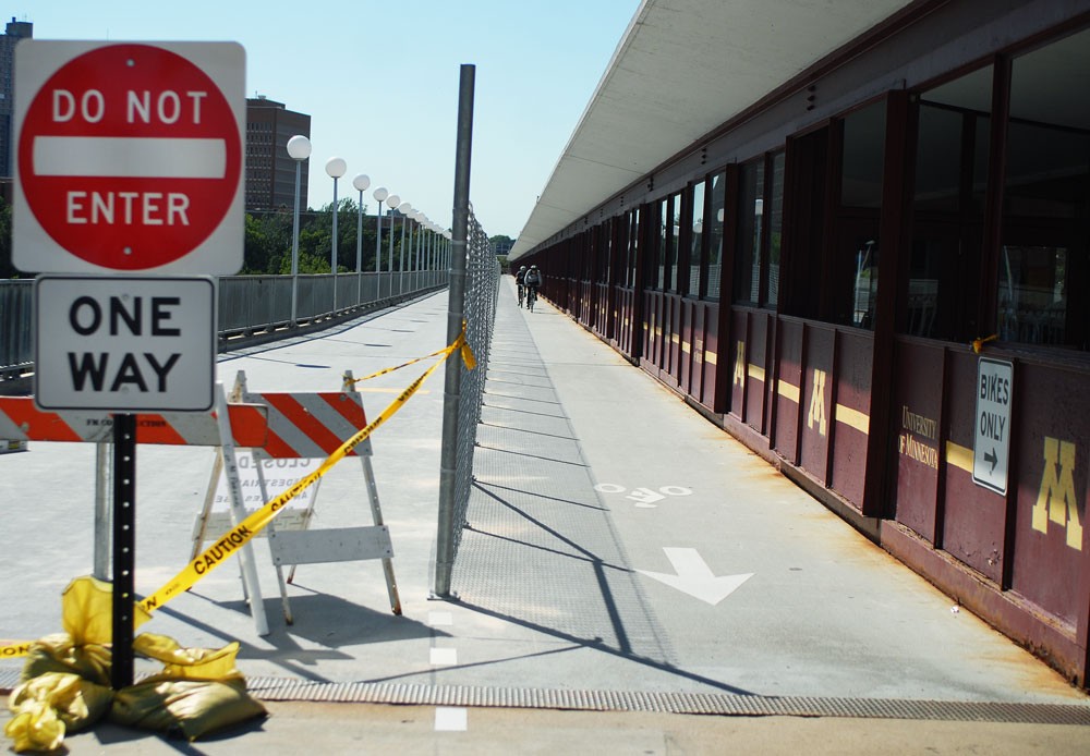 Bikers can no longer use the outside bike paths to get across after the lanes were closed Wednesday.  Bicyclists will have to walk their bikes in the enclosed middle portion of the bridge.