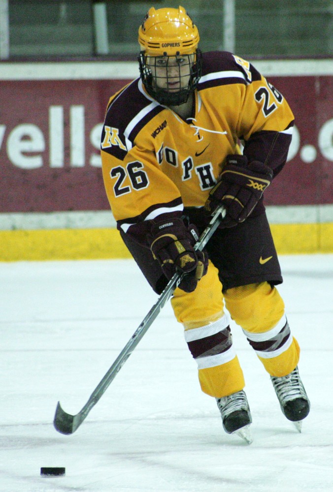 Junior Michelle Maunu moves the puck and looks for an outlet in a game last year. Maunu was around to feel the sting of missing out on a national title and will head to Duluth this weekend to try to unseat the defending champs. 