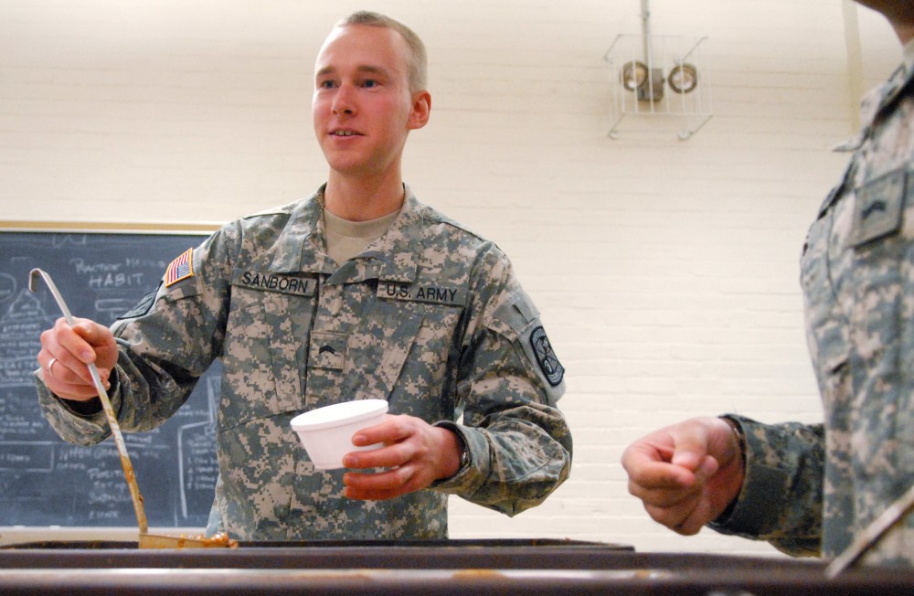Army Cadet and nursing sophomore Aaron Sanborn dishes up chili at the second annual Student Veterans Appreciation Day on Wednesday in the Armory. 