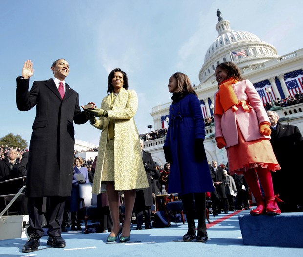 Barack Obama, left, takes the oath of office from Chief Justice John Roberts, not seen, as his wife Michelle, holds the Lincoln Bible and daughters Sasha, right and Malia, watch at the U.S. Capitol in Washington, Tuesday, Jan. 20, 2009. (AP Photo/Chuck Kennedy, Pool)