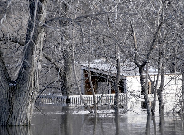 A structure that residents say was a tree house is now almost entirely underwater in a south Fargo neighborhood on Saturday.