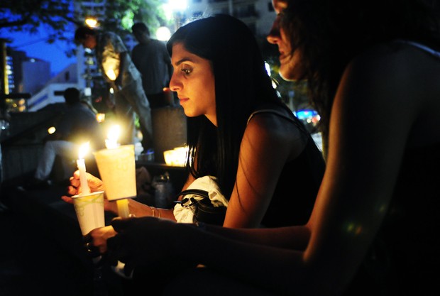 University biology graduate student Hoda Saedi and her friend, pharmacist Jessica Reiter, attend a vigil Monday at Peavey Plaza in downtown Minneapolis. The vigil was to honor those currently part of the conflict in Iran. 
