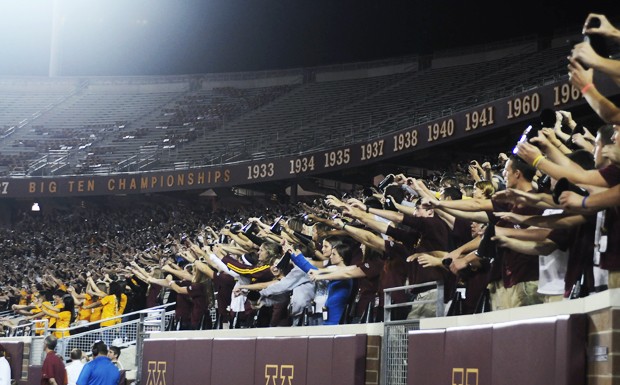 University of Minnesota first-year students participate in cheers led by the University Spirit Squad at the TCF Bank Stadium on Thursday.