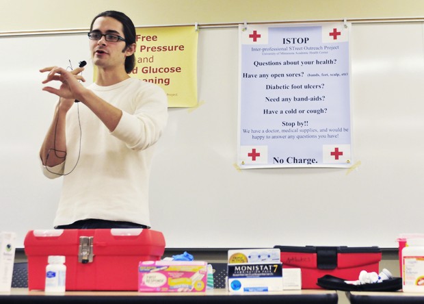 University second-year medical student Jacob Feigal gives a demonstration Monday during a training session for potential ISTOP members.   