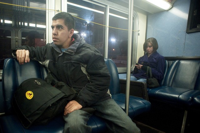 Minneapolis residents Hector Rosanes, left,  and Melanie Devine, right, ride the number 2 bus to work at 6:30 am on Friday.