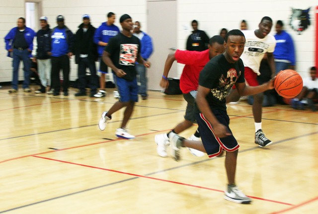 A participant in Phi Beta Sigma’s Hoops for Haiti basketball tournament runs down the court at a YMCA rec. center in North Minneapolis on Saturday. The basketball tournament raised money for the victims of the Haiti earthquake.