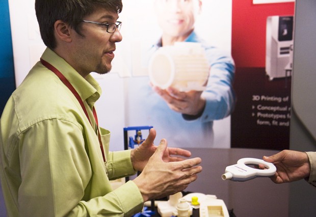 Matt Havekost of Stratasys explains how a 3D printer makes intricate prototypes to a conference attendee at the 2010 Design and Medical Devices Conference on Wednesday.