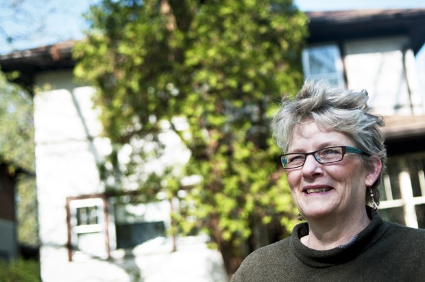 Mary Mateer stands in front of her house in the Seward neighborhood. Mateer had rented the house in 1977 until she bought it in the late 1990s.