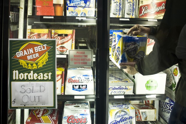 A customer purchases beer Saturday at Surdyk’s in Minneapolis. 