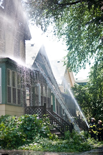 Minneapolis Fire Department firefighters extinguish a house fire Saturday afternoon on 17th Ave. SE.