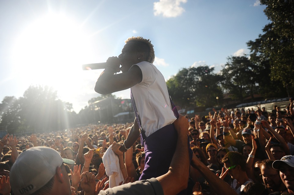 Major Lazer hype man Skerrit Bwoy jumps into the crowd during their Sunday performance at Pitchfork Music Festival.