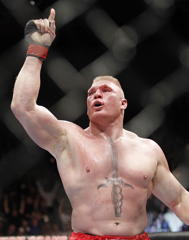Brock Lesnar celebrates his second round victory over Shane Carwin during their UFC heavyweight mixed martial arts title match Saturday, July 3, 2010, at The MGM Grand Garden Arena in Las Vegas. (AP Photo/Eric Jamison)