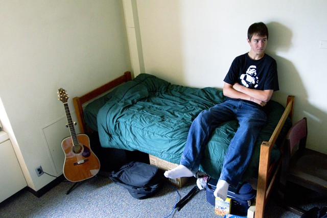 First year Tom Sitzman sits in his Middlebrook Hall room on Friday. Sitzman came to the University hoping to find the kind of thoughtful discussion he couldn’t find at home in Otsego, Minn.