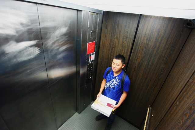 Freshman Keen Thao waits in the elevator Friday in Bailey Hall.