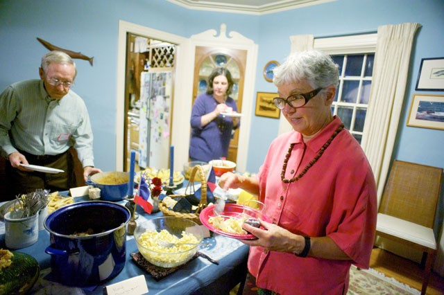 State representative Phyllis Kahn of district 59b puts together a plate of French food during a fundraiser for her campaign Friday evening at a supporter’s house.
