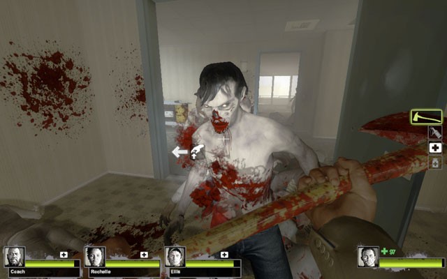 A screenshot from Valve’s popular Left 4 Dead 2 videogame depicts the player using an axe to decapitate and dismember attacking zombies.