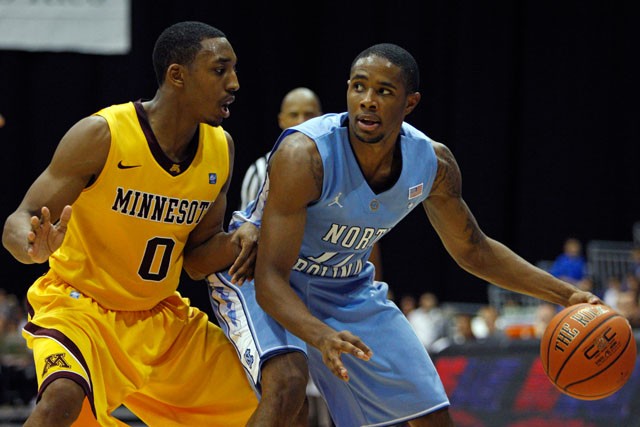 North Carolinaís Larry Drew II, right, drives the ball against Minnesotaís Al Nolen during the second half of an NCAA college basketball game in San Juan, Puerto Rico, Friday, Nov. 19, 2010. Minessota won 72-67. (AP Photo/Ricardo Arduengo)