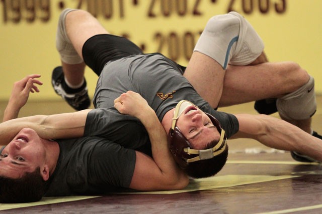 Mike Thorn wrestles redshirt freshman Bart Reiter during a practice November 2 at Bierman Athletic Complex.