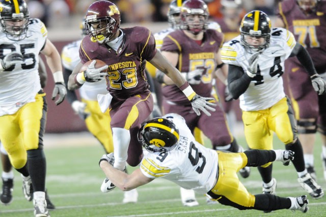 Junior running back DeLeon Eskridge attempts to break through Iowa’s defense Saturday at TCF Bank Stadium.