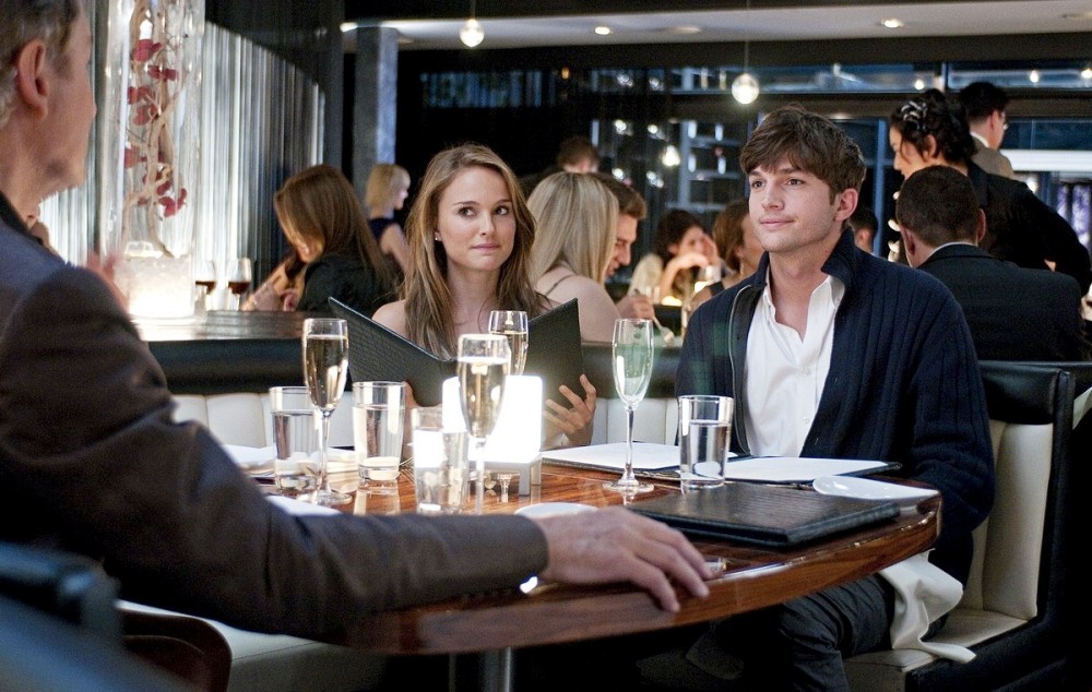 Emma (Portman) and Adam (Kutcher) share an unromantic meal.