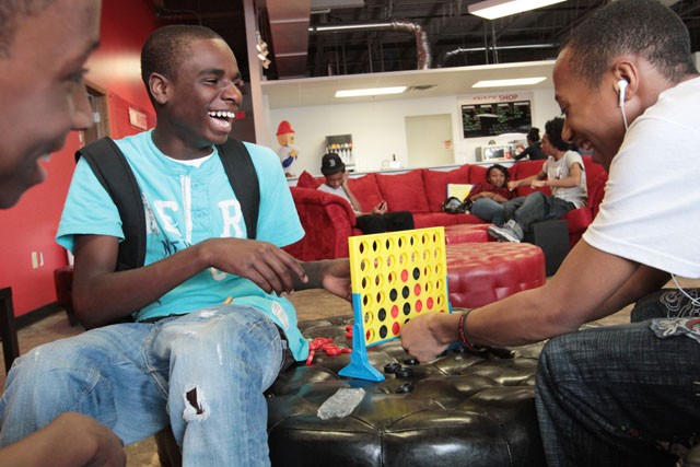 Seventh grader D’Angelo Spring, center, plays Jamar Blunt in connect four Monday at the The A-list teen center in Brooklyn Park.