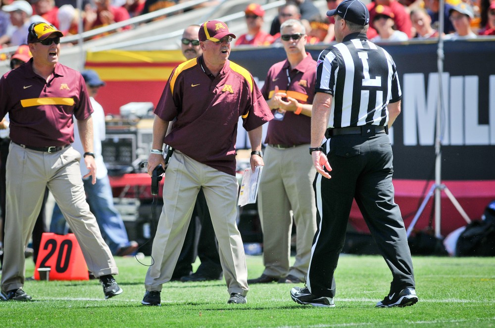 Gophers head coach Jerry Kill confronts an official after receiving a penalty for an illegal substitution.