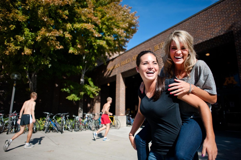 Marissa and her sister Brianee Price pose for a portrait outside of Bierman.