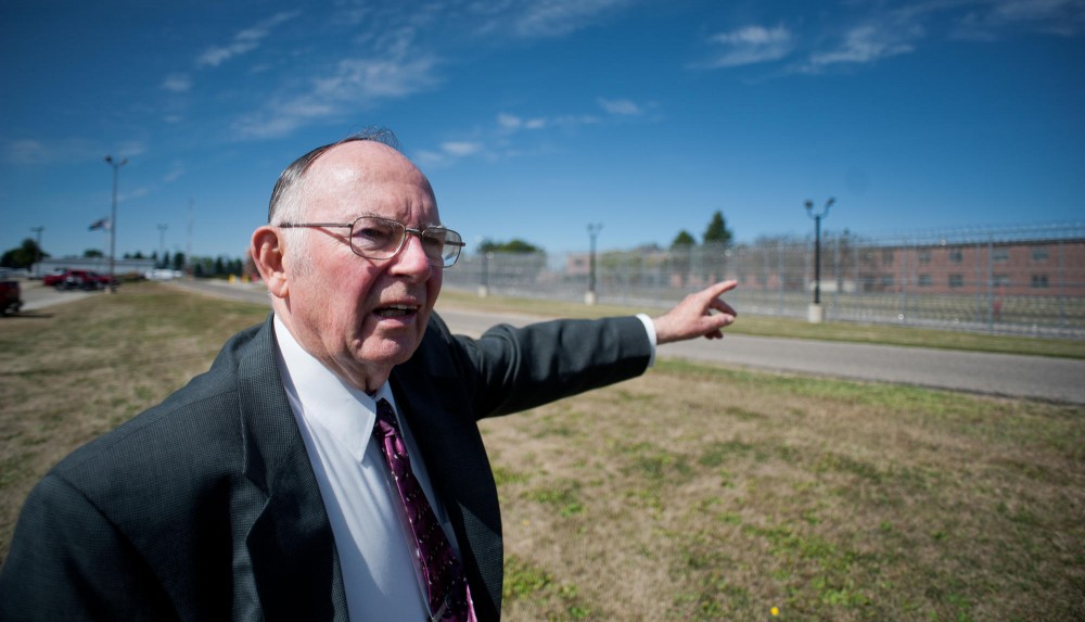 Former University of Minnesota, Waseca Chancellor Edward Frederick surveys the campus, now a federal prison, that he opened 40 years ago today.