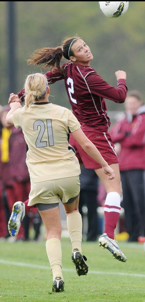 Junior Nicole Baier goes up for a header Sunday during a game against Purdue in Falcon Heights.  