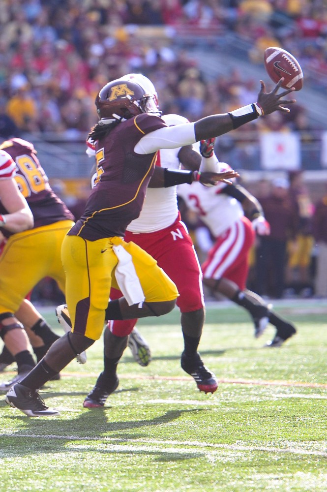 Gophers quarterback MarQueis Gray fumbles the ball during a drive against Nebraska Saturday at TCF Bank Stadium.  Huskers safety Austin Cassidy recovered the ball for a touchdown.