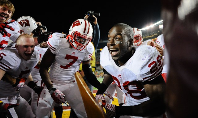 Minneapolis - Nov. 12, 2011 - Wisconsin running back Montee Ball attacks a goal post with Paul Bunyans Axe after the Badgers defeated Minnesota 42-13 on Saturday at TCF Bank Stadium.