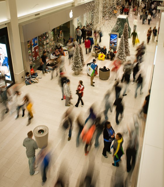 Shoppers stream through the Mall of America during the start of the holiday season.