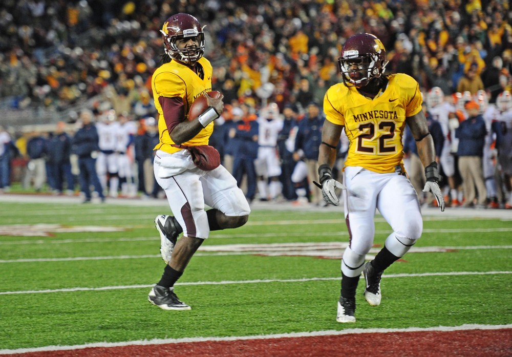 Minnesota quarterback MarQueis Gray walks the ball into Illinois end zone for a touchdown Saturday at TCF Bank Stadium.