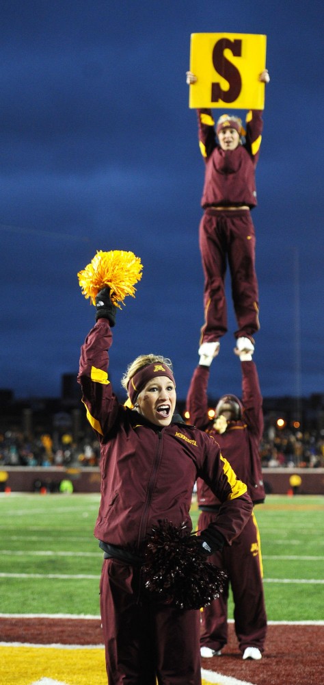 Members of the Minnesota spirit squad lead cheers after the Gophers scored a touchdown against Illinois on Saturday at TCF Banks Stadium.