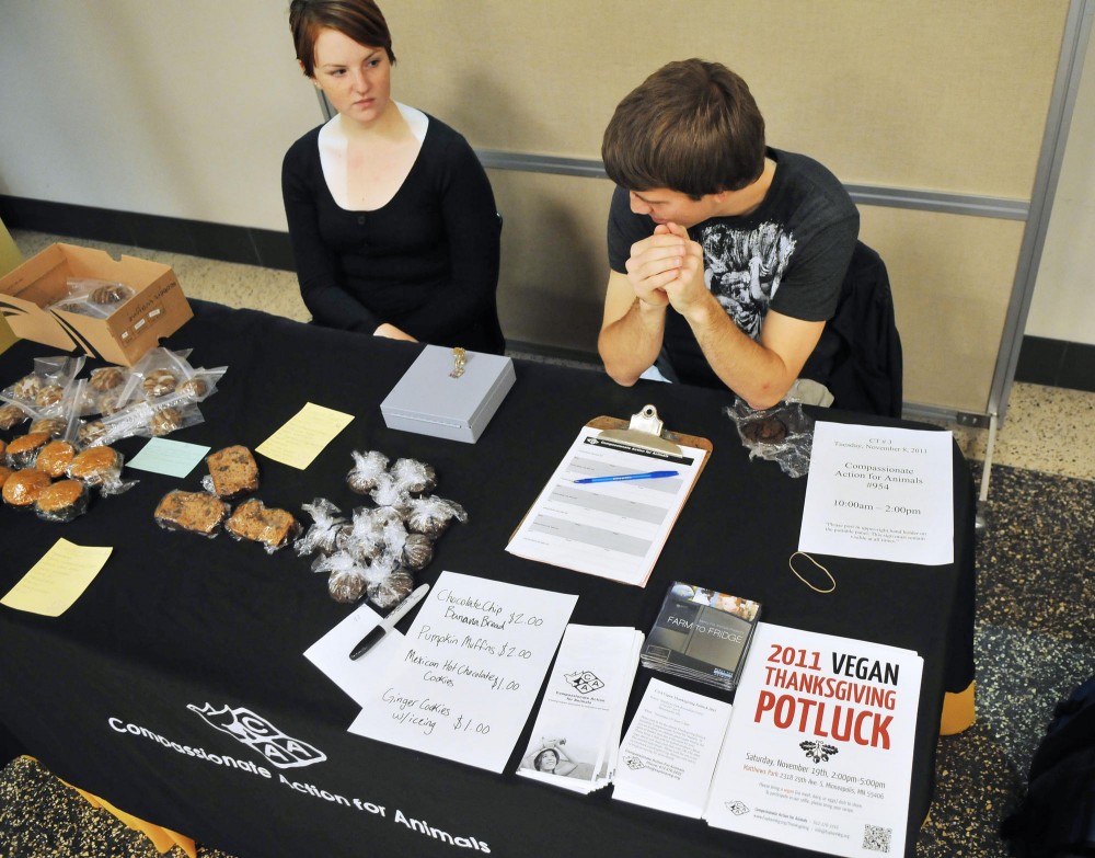Sophomore Mary Musielewicz and senior Jake Nath sell items Tuesday during their vegan bake sale at Coffman Union.  Musielewicz and Nath are student officers for Compassionate Action for Animals, a group that works to promote respect for animals and vegetarianism in the Twin Cities.