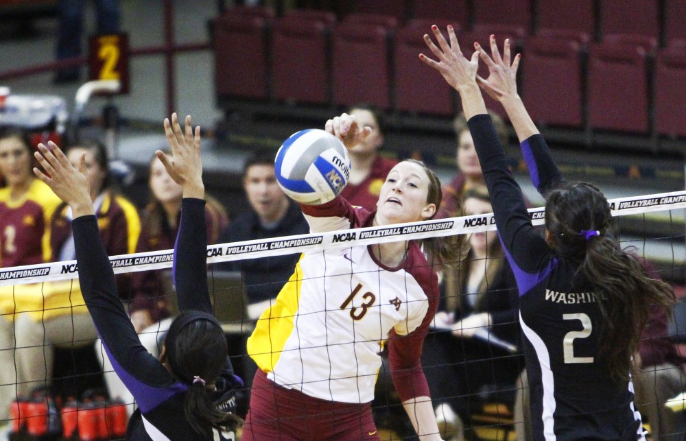 Outside hitter Ashley Wittman spikes the ball past Washington Saturday at the Sports Pavilion. Minnesota beat Washington in five sets and will advance to the NCAA regionals.