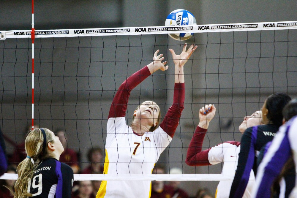 Minnesota setter Mia Tabberson readies the ball for an attack against Washington Saturday at the Sports Pavilion. Minnesota beat Washington in five sets and will advance to the NCAA regionals.