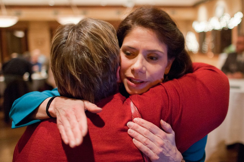 Senator-elect Kari Dziedzic hugs Senator Linda Higgins at her election night party Tuesday at Elsies Restaurant in Minneapolis. Dziedzic won the special election for Senate District 59 with 79 percent of the vote.