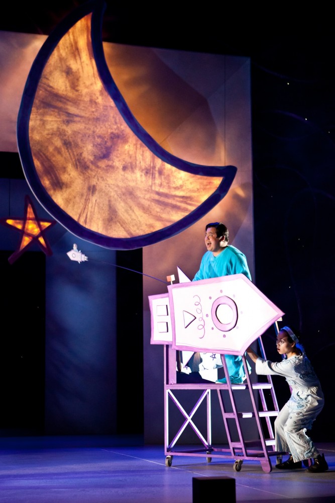 Harold, played by Don Darryl Rivera, reaches for the moon from his rocket ship, with help from co-star Khanh Doan.