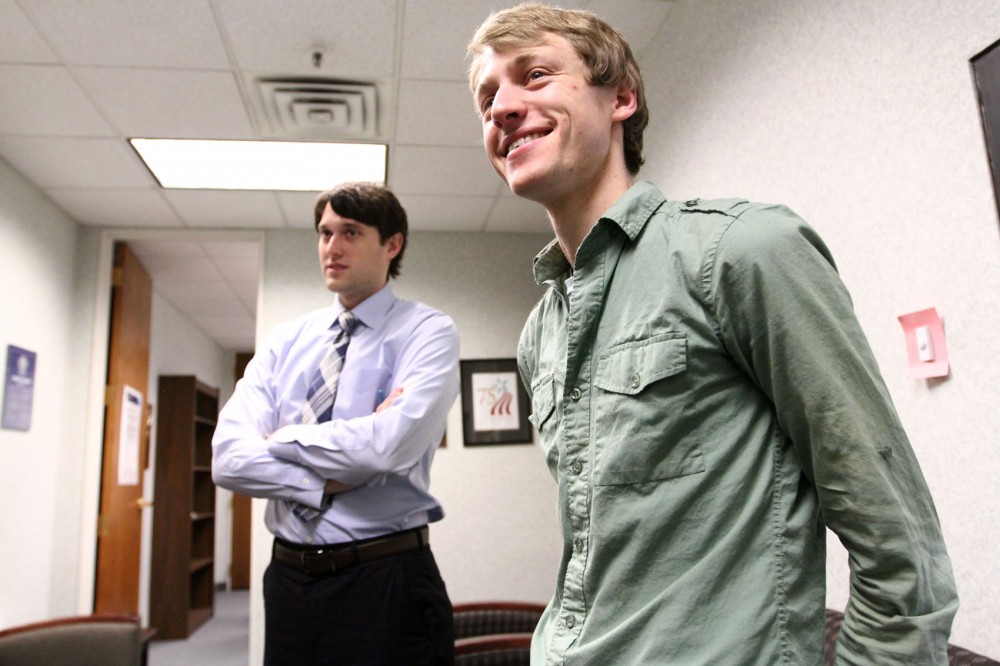 Erik Forman, right, stands with his attorney Tim Louris on Wednesday at the National Labor Relations Board office of Minneapolis. Forman was terminated from Jimmy Johns in the spring of 2011.