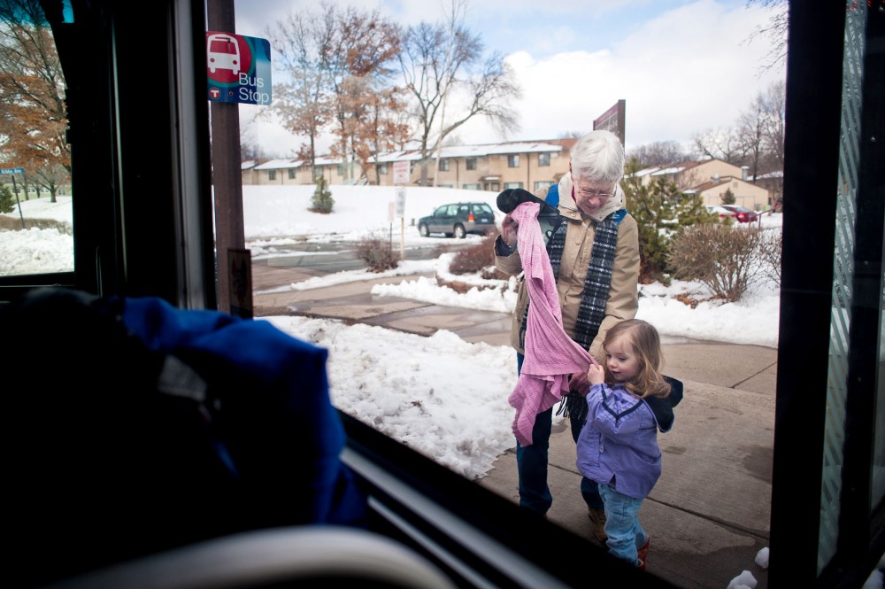 Mary Gotz and her granddaughter, Greta, step off the bus after visiting the bears at the Como Zoo.
Gotz has never owned a car.