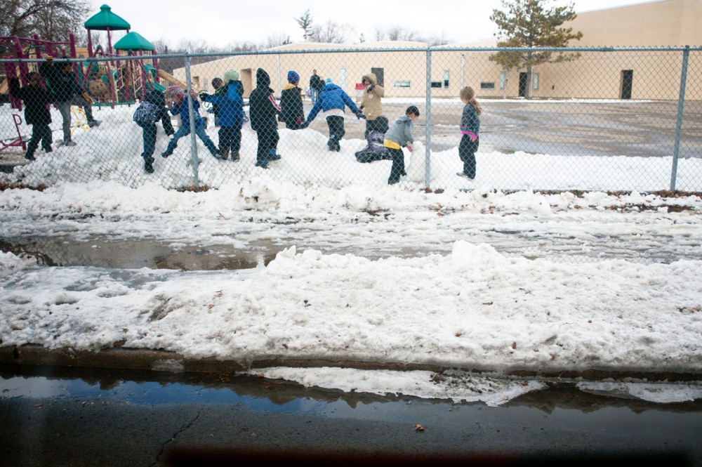 Children play in the snow outside of Como Park Elementary School on Thursday along West
Maryland Avenue. In 2011, the 3 bus route served 2.74 million riders.
