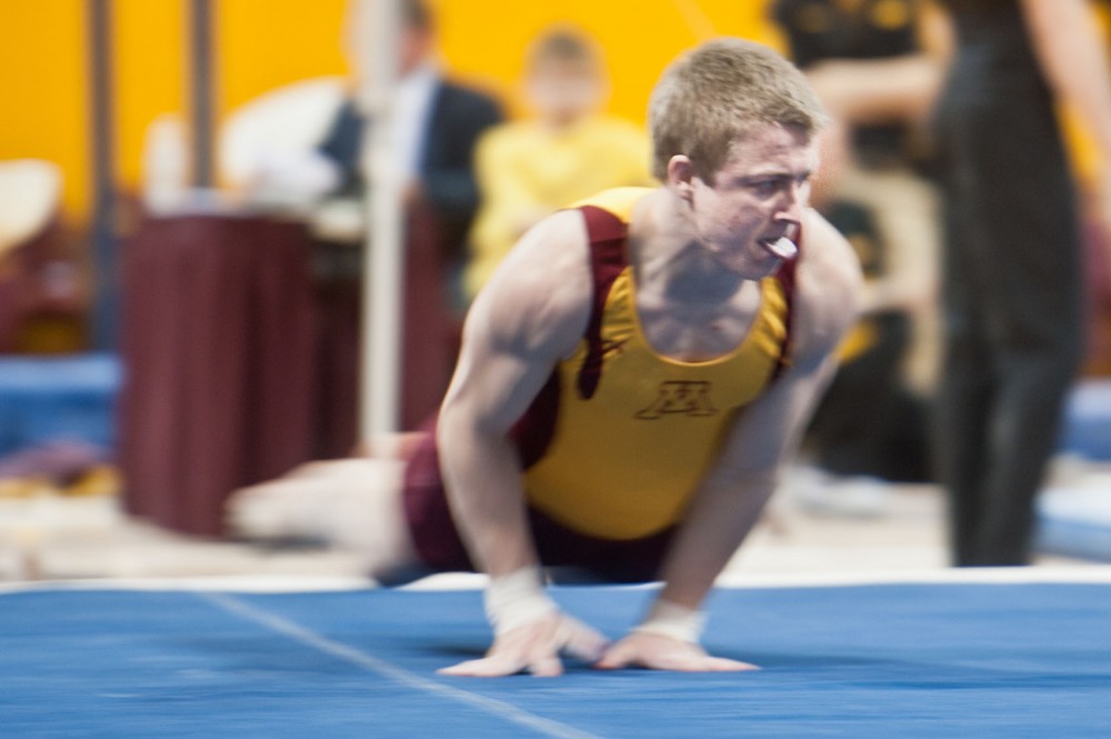 Minnesota sophomore Adam Kern performs his routine on the floor Saturday at the Sports Pavilion.