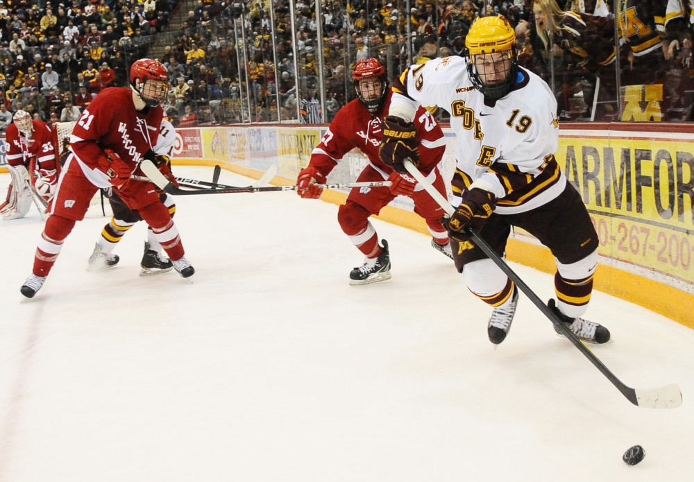 Minnesota forward Erik Haula handles the puck during Saturday night’s game against Wisconsin at Mariucci Arena.  Haula scored a shorthanded goal early in the third period to tie the game.