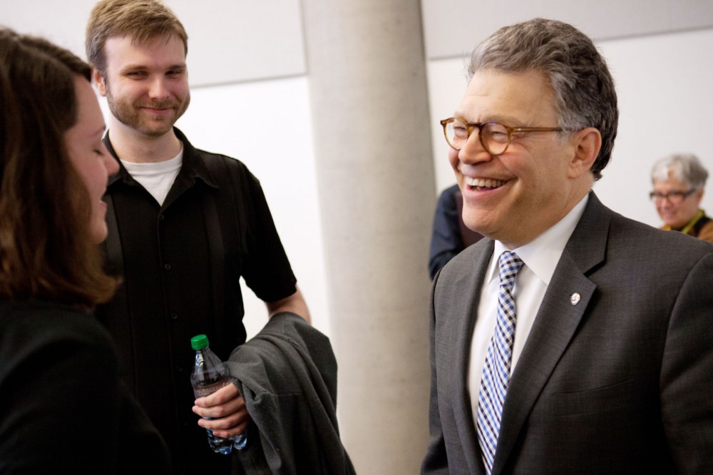 Senator Franken thanks junior Sophie Wallerstedt for sharing her story about the struggle she is having with student debt and assures her that she made a sound investment.