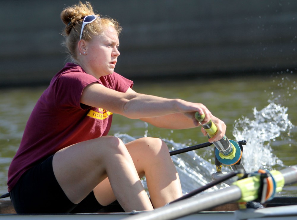 Ali Haws rows during practice Wednesday on the Mississippi River. Haws started as a member of the novice team and has worked her way up to the first varsity eight.
