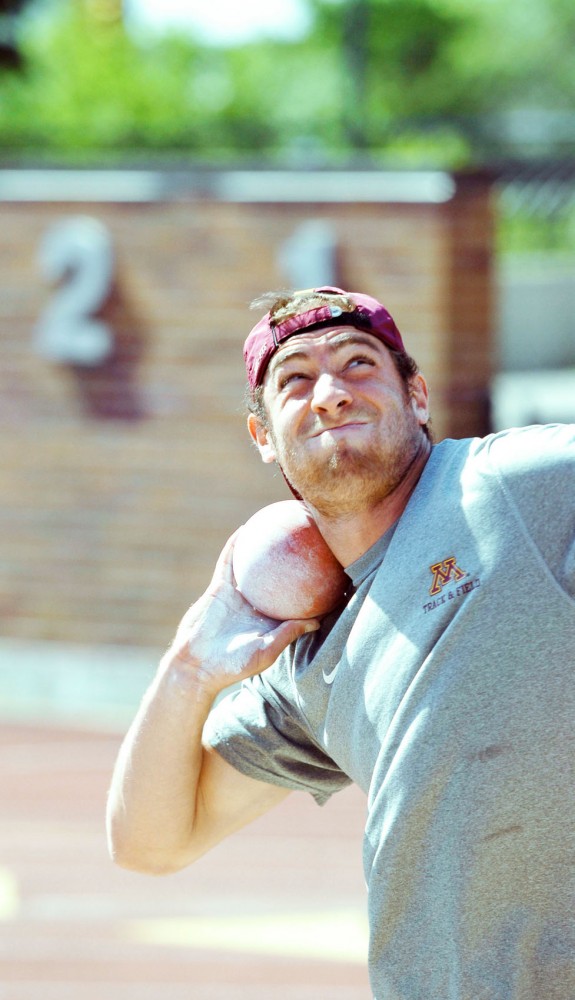 Decathlete Jack Szmanda practices the shot put Friday at Bierman Field. Shot put is one of the 10 events Szmanda will compete in at the NCAA championships.
