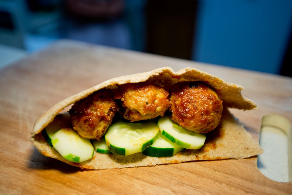 A finished meatball and cucumber wrap.