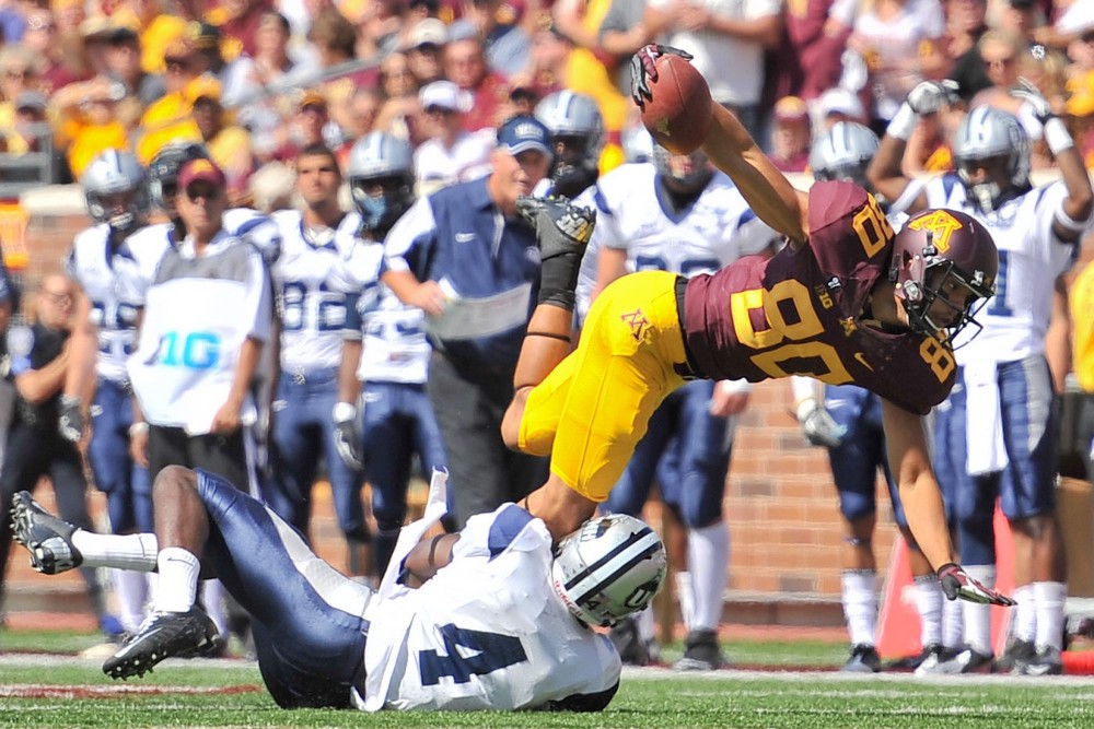 Minnesota wide receiver Devin Crawford-Tufts is taken down by New Hampshire safety Manny Asam on Saturday at TCF Bank Stadium.