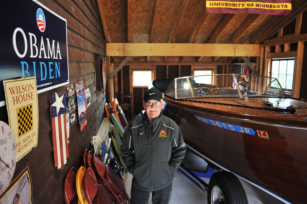 Head womens cross country coach Gary Wilson stands in the addition to his barn, which he built with his sons to house his 1950 Chris Craft classic wooden boat, on Friday at his home in Stillwater, Minn. Wilson will retire in June after 28 years coaching the Gophers.